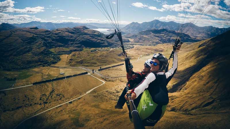 Experience an exhilarating big mountain paragliding flight with stunning views of Lake Wanaka!